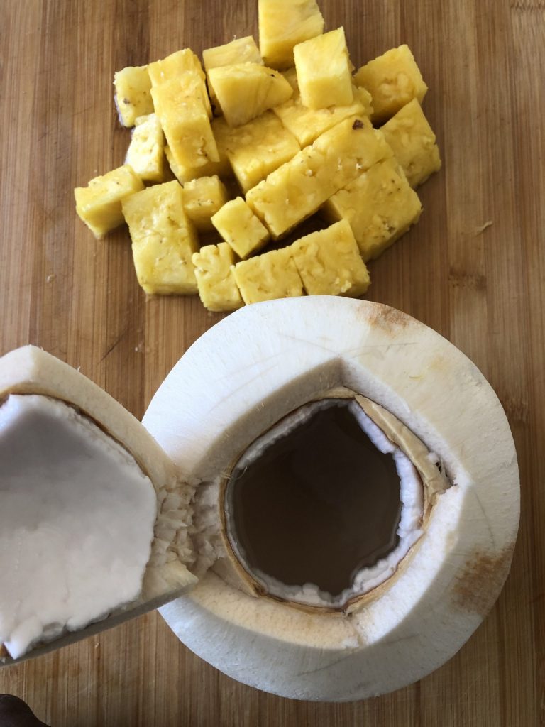 chopped pineapple and opened coconut scaled 1