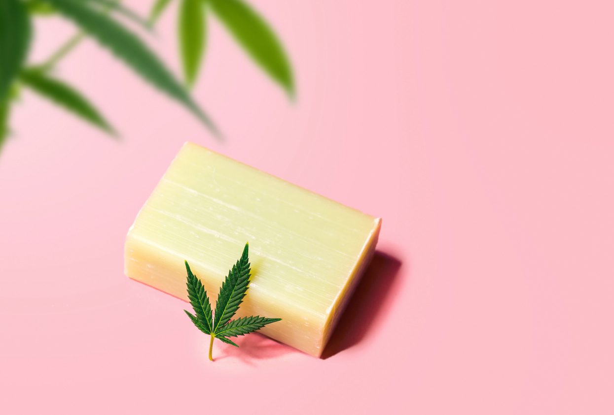 CBD Cannabidiol infused soap on pink background, concept of the use of Hemp in skin personal hygiene products