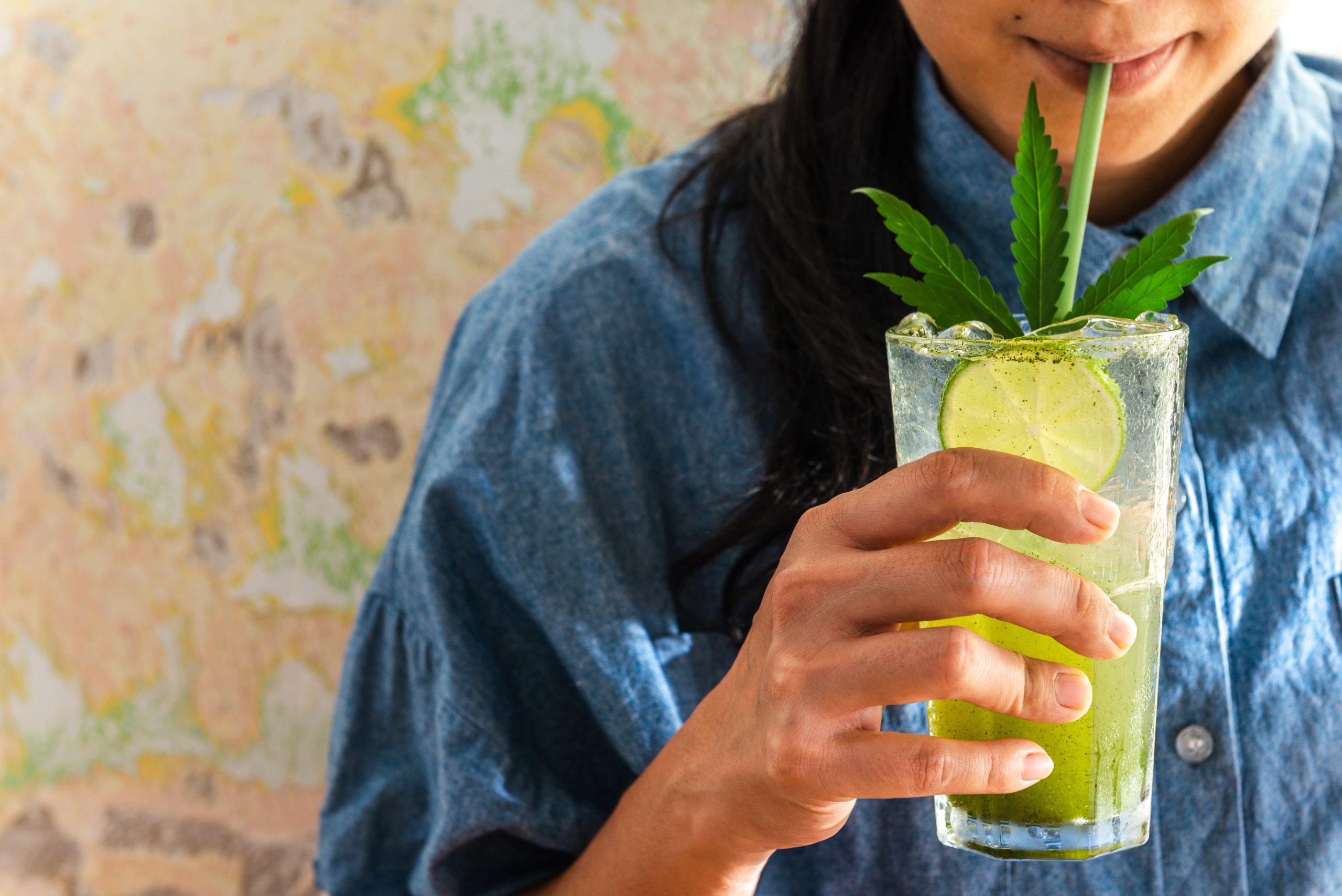 Lady Drinking THC Drink with Straw